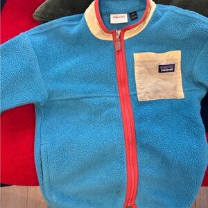 Patagonia Teal Fleece with Red Zip and Beige Pocket